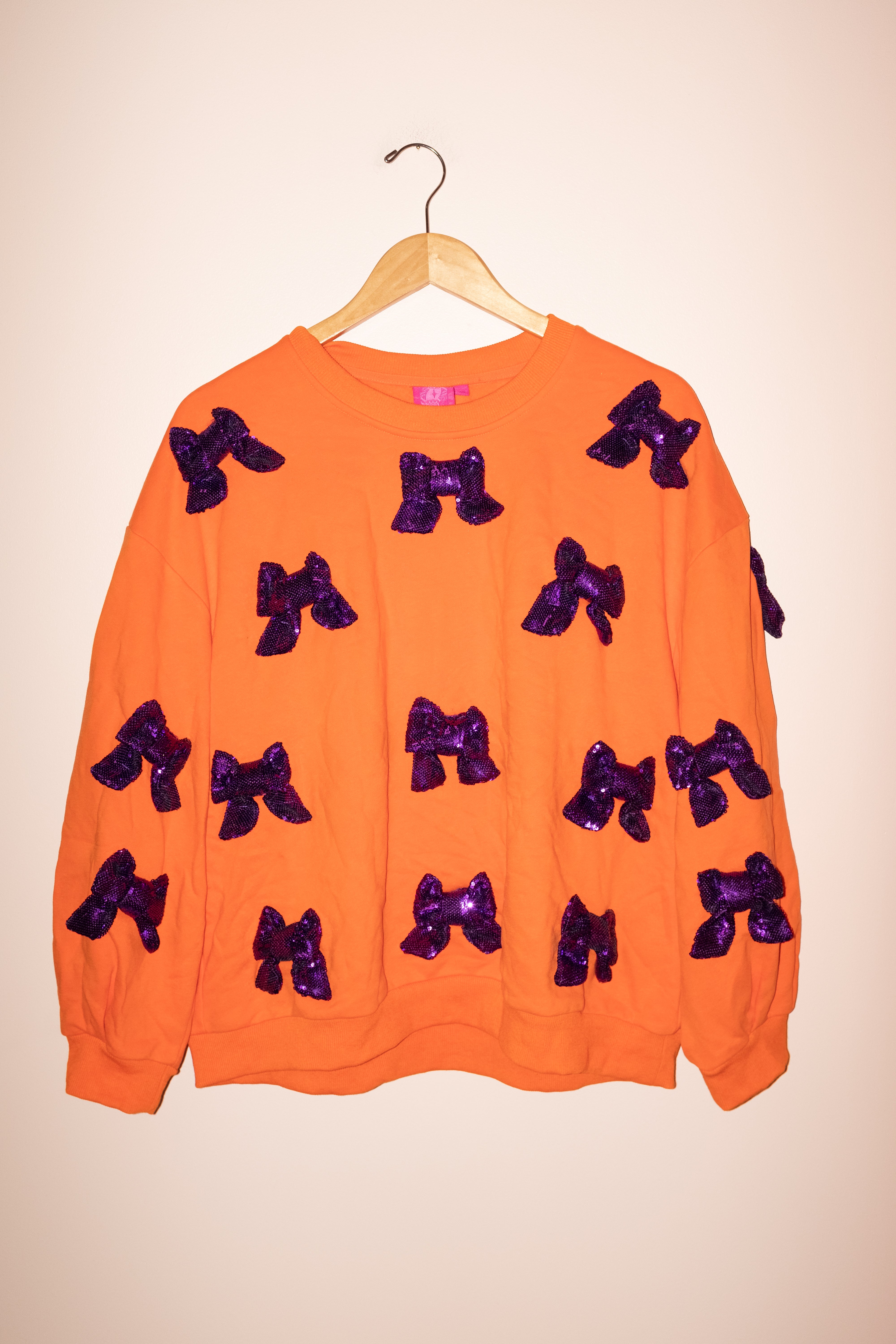 SAMPLE- ORANGE W/ PURPLE 3D SEQUIN BOW SWEATSHIRT