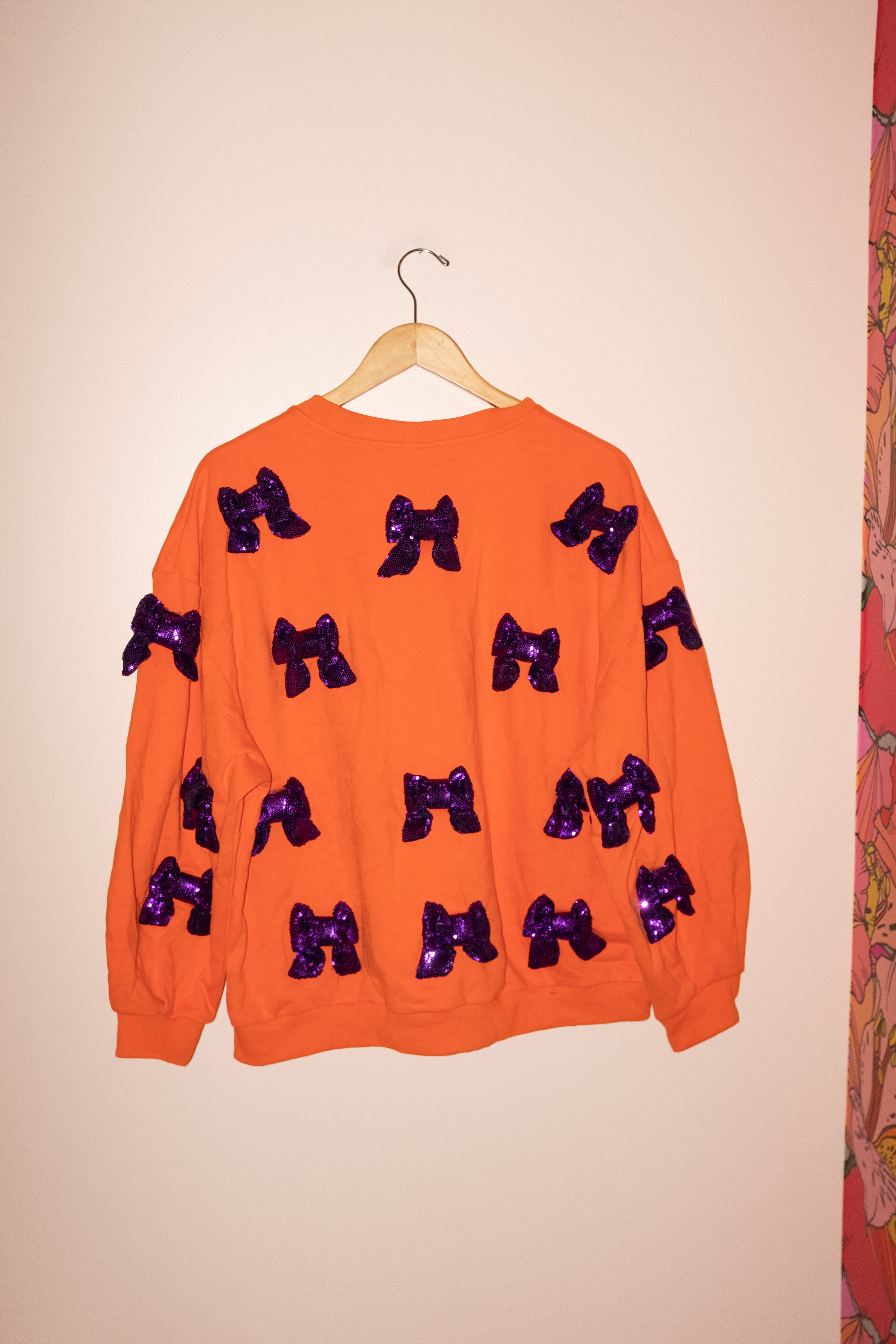 SAMPLE- ORANGE W/ PURPLE 3D SEQUIN BOW SWEATSHIRT