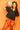 Black & Orange QOS Jersey Peplum Top